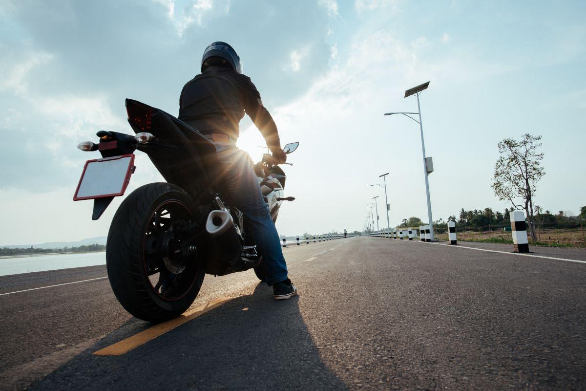 Rider Motorbike on the road riding. having fun driving the empty road
