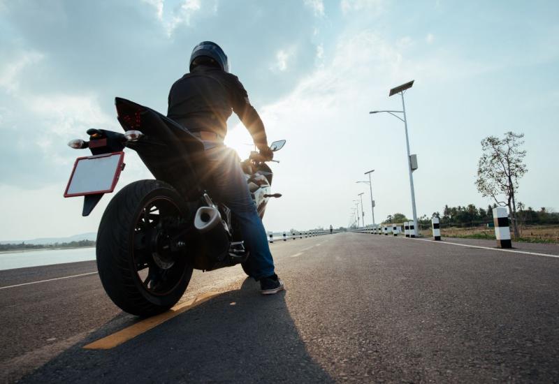 Rider Motorbike on the road riding. having fun driving the empty road